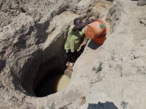 This part of Africa only gets rain one month in the year so the water hole gets deeper, more difficult and dangerous to utilize during the long dry season.